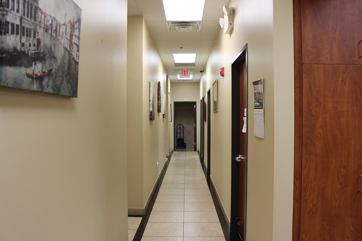 Interior hallway connecting exam rooms at the Tomball office